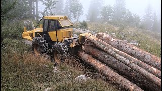 Skidder Ecotrac skidding big logs on rocky Mountain [upl. by Fricke945]