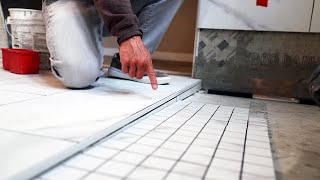 CURBLESS SHOWER TRANSITION  HOW TO TAPER TILE TO DRAIN [upl. by Maddeu311]