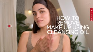 How to remove makeup using a cleansing oil  Clarins [upl. by Topliffe501]