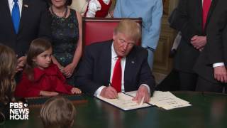 Trump signs first official documents as US president [upl. by Gerianna225]