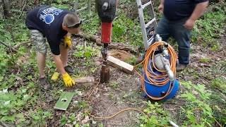 Driving a sandpoint well with a jackhammer [upl. by Georgia]